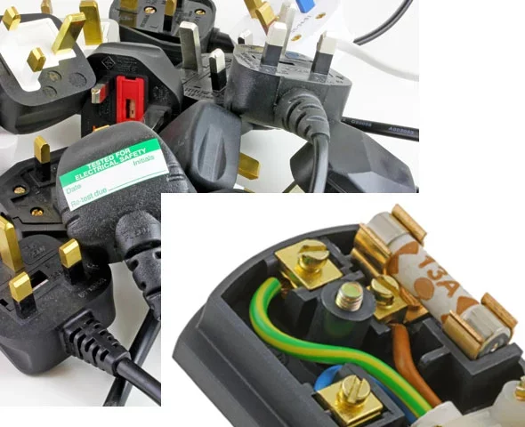 Image shows a pile of electrical plugs